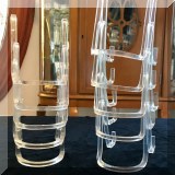 D48. Set of 10 plastic plate stands - $10 